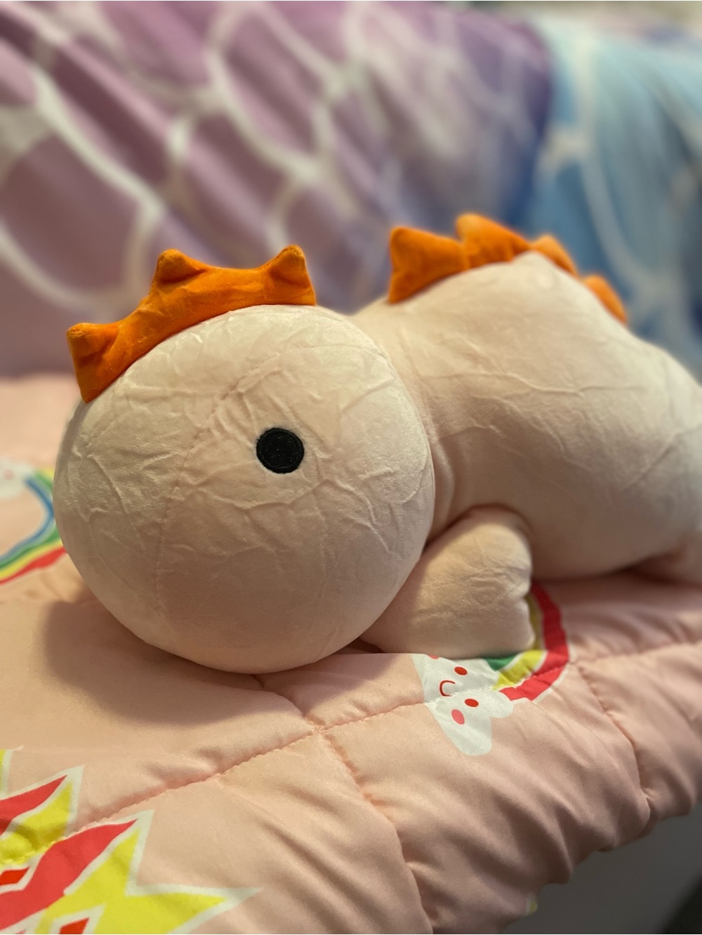 Weighted Dinosaur Pillow - Soft Peach with Orange Spikes